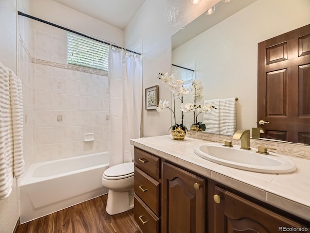 10050 Eagle Valley Way, Highlands Ranch, CO 80129 - full bathroom with wood finished floors, vanity, and shower / tub combo