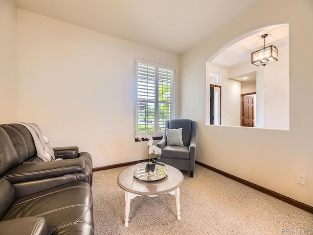 10050 Eagle Valley Way, Highlands Ranch, CO 80129 - carpeted living area featuring arched walkways and a chandelier