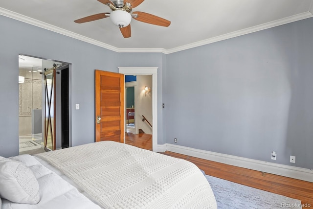 bedroom with ceiling fan, baseboards, crown molding, and wood finished floors
