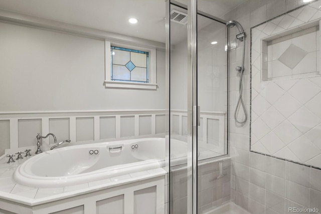 full bathroom featuring visible vents, a shower stall, recessed lighting, and a garden tub