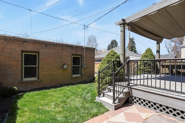 view of yard with a wooden deck