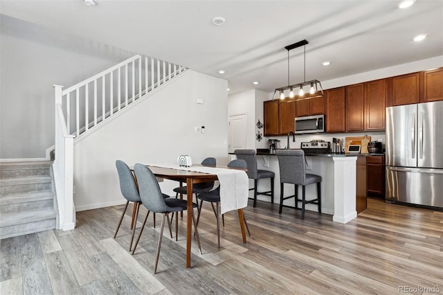 dining room featuring light hardwood / wood-style flooring