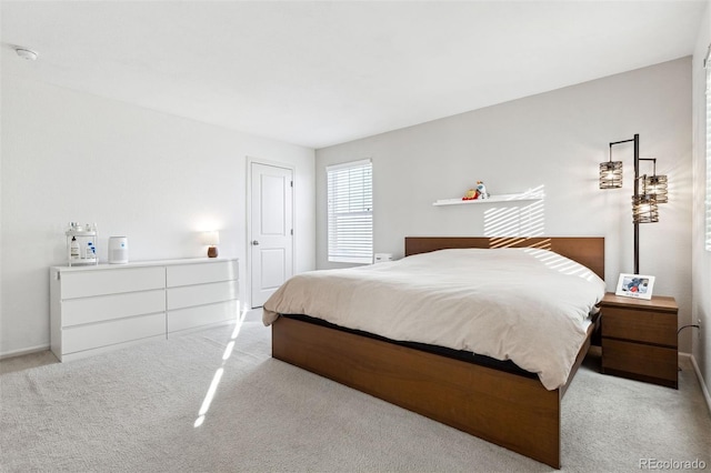 bedroom with light colored carpet