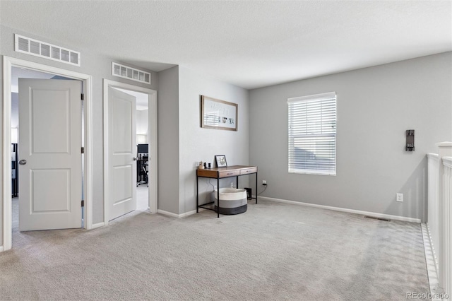 interior space featuring a textured ceiling