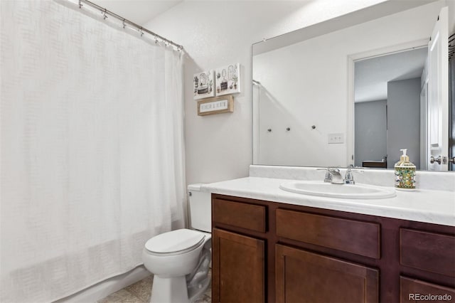 full bathroom featuring tile patterned flooring, vanity, shower / bath combination with curtain, and toilet