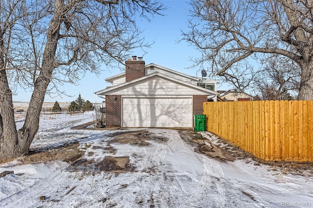 view of snow covered garage