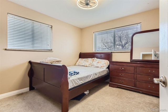 bedroom with light colored carpet