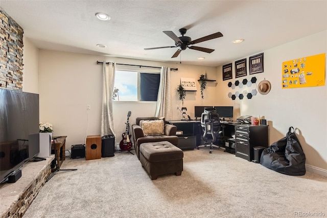 carpeted home office with ceiling fan