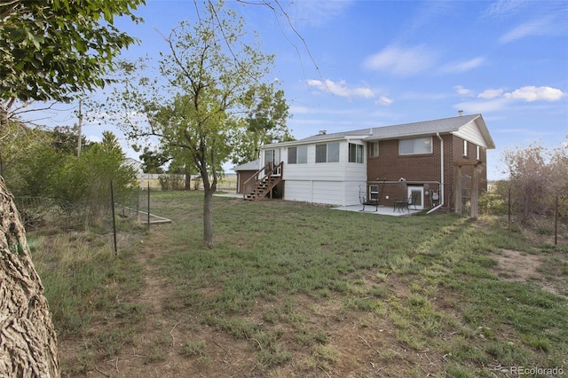 exterior space featuring a yard and a patio