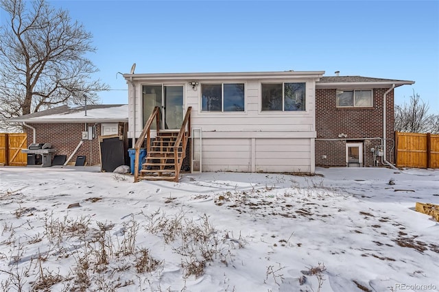 view of snow covered house