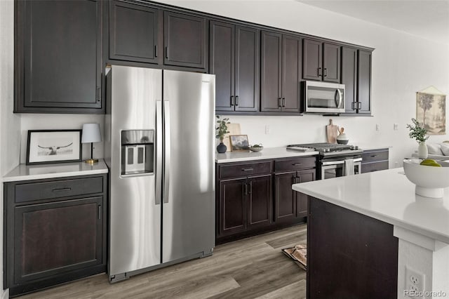 12547 Lake View St, Longmont, CO 80504 - kitchen featuring stainless steel appliances, light countertops, and light wood-type flooring