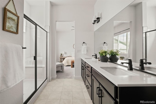 12547 Lake View St, Longmont, CO 80504 - full bath featuring a stall shower, connected bathroom, tile patterned floors, and double vanity