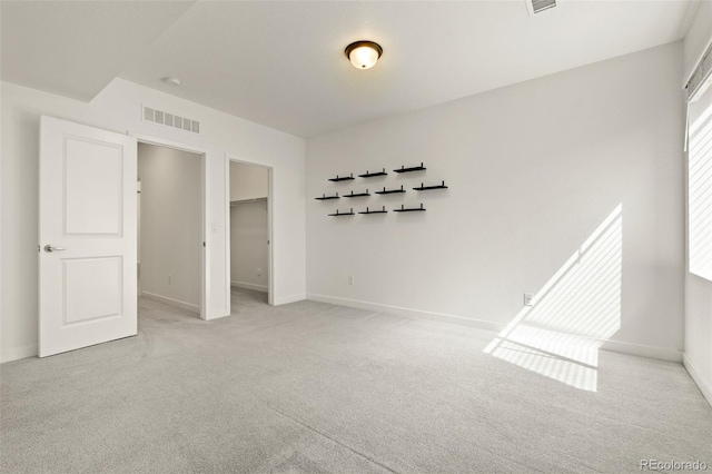 12547 Lake View St, Longmont, CO 80504 - unfurnished bedroom featuring light carpet, baseboards, and a spacious closet