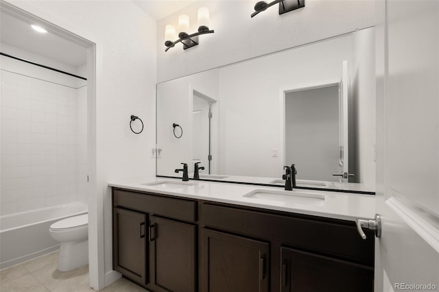 12547 Lake View St, Longmont, CO 80504 - bathroom featuring toilet, double vanity, tile patterned floors, and tub / shower combination