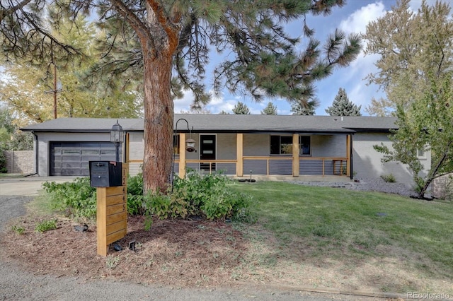 ranch-style house with a front yard and a garage