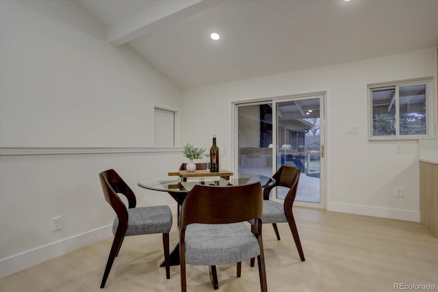 dining area featuring vaulted ceiling with beams and light wood-type flooring