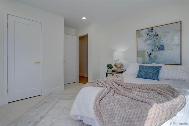 bedroom with light colored carpet