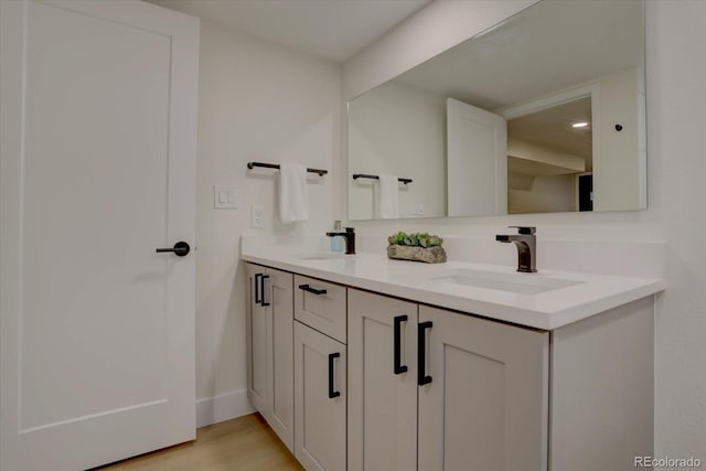 bathroom featuring vanity and hardwood / wood-style flooring