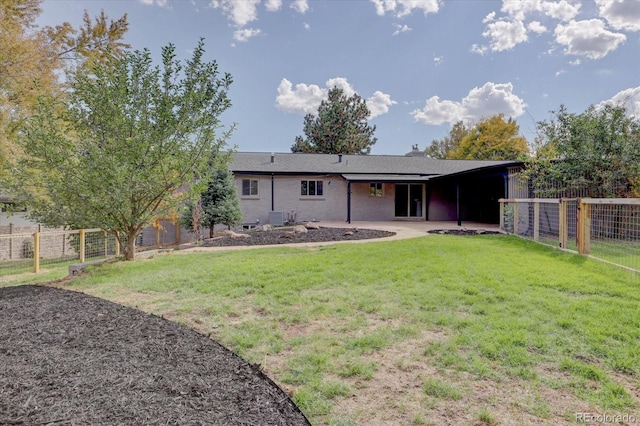 back of house with a lawn and central air condition unit