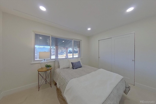 carpeted bedroom featuring a closet