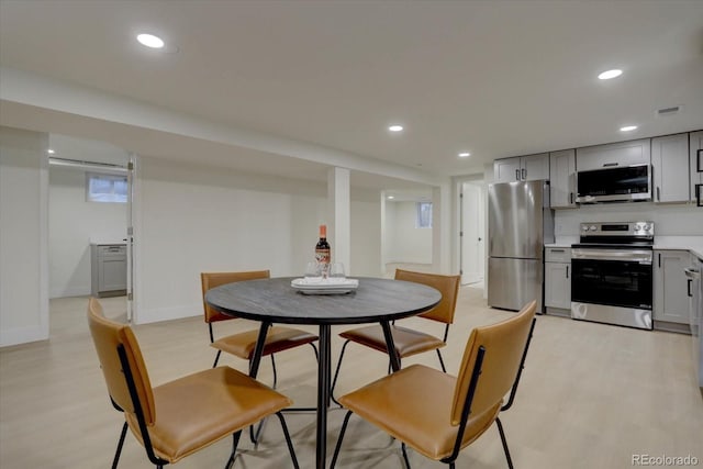 dining area with light hardwood / wood-style flooring