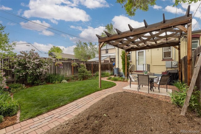 view of yard with a pergola and a patio area