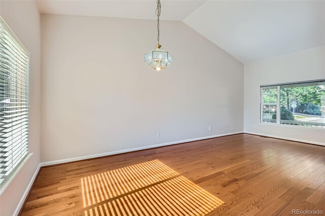 12701 Elm Ln, Broomfield, CO 80020 - spare room featuring vaulted ceiling and wood finished floors
