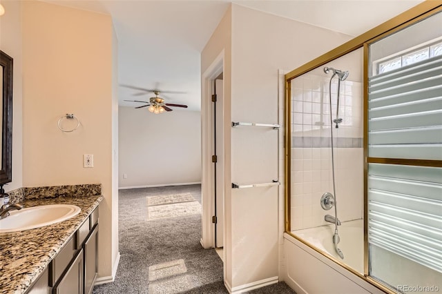 12701 Elm Ln, Broomfield, CO 80020 - full bath with vanity, a ceiling fan, and bath / shower combo with glass door