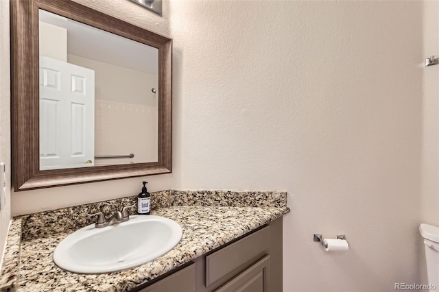 12701 Elm Ln, Broomfield, CO 80020 - bathroom featuring vanity and toilet