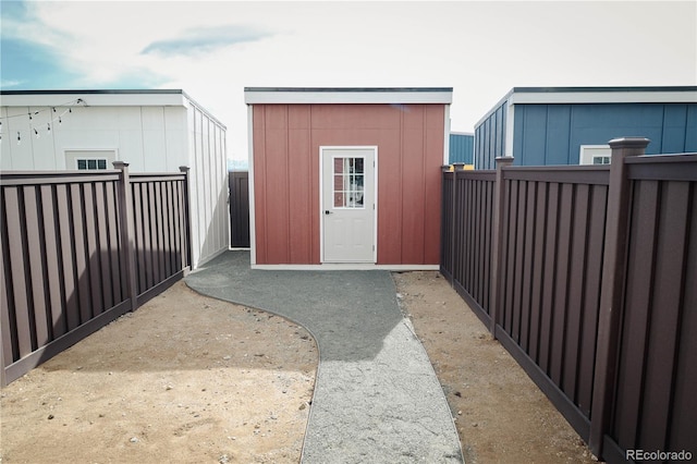 view of shed with a fenced backyard