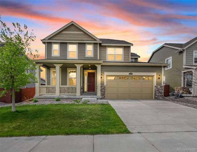 14850 Oslo Ave, Parker, CO 80134 - view of front facade featuring covered porch, driveway, and stone siding