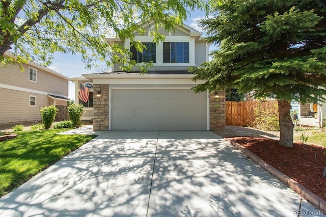 1462 Marigold Dr, Lafayette, CO 80026 - view of front of house with stone siding, an attached garage, and driveway