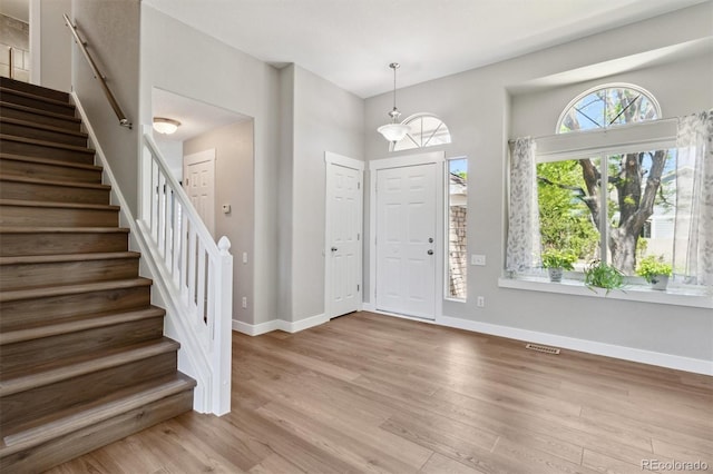1462 Marigold Dr, Lafayette, CO 80026 - entryway with stairway, wood finished floors, and baseboards