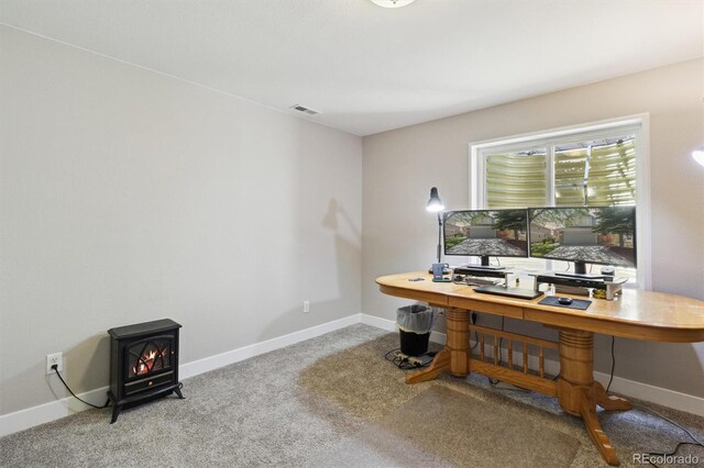 1462 Marigold Dr, Lafayette, CO 80026 - carpeted office featuring a wood stove and baseboards