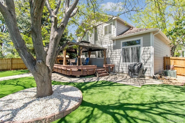 1462 Marigold Dr, Lafayette, CO 80026 - back of property featuring a gazebo, a wooden deck, central air condition unit, and a patio