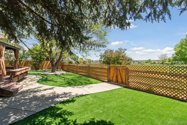 1462 Marigold Dr, Lafayette, CO 80026 - view of yard featuring a gate