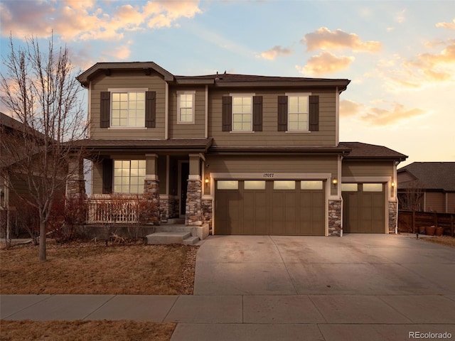 view of front of home featuring covered porch and a garage