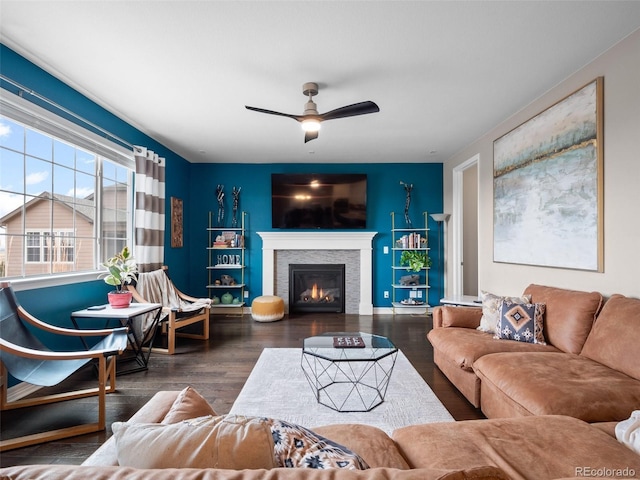 living room with ceiling fan and dark hardwood / wood-style floors