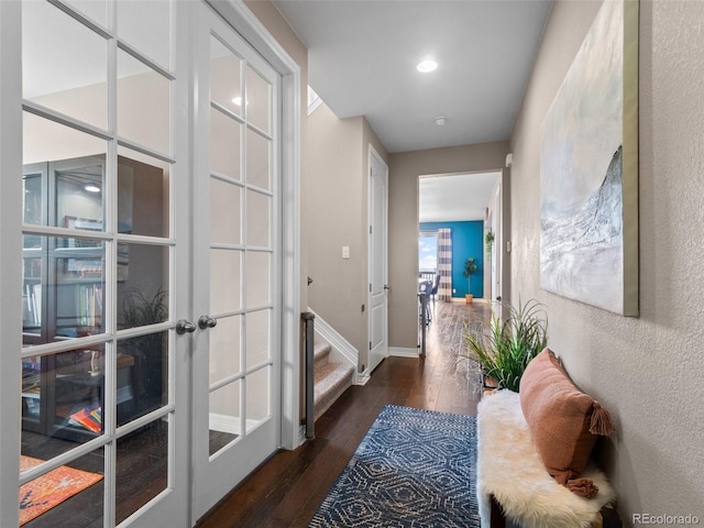 entryway with french doors and dark wood-type flooring