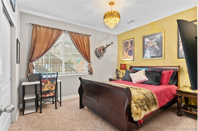 carpeted bedroom featuring a chandelier