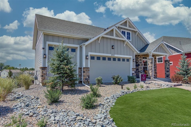 craftsman inspired home with a garage and a front yard