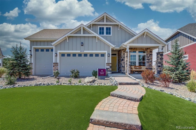 craftsman house featuring a garage and a front yard