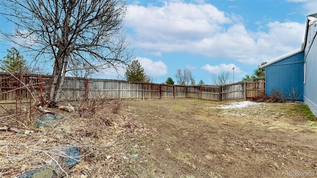 view of yard with a fenced backyard