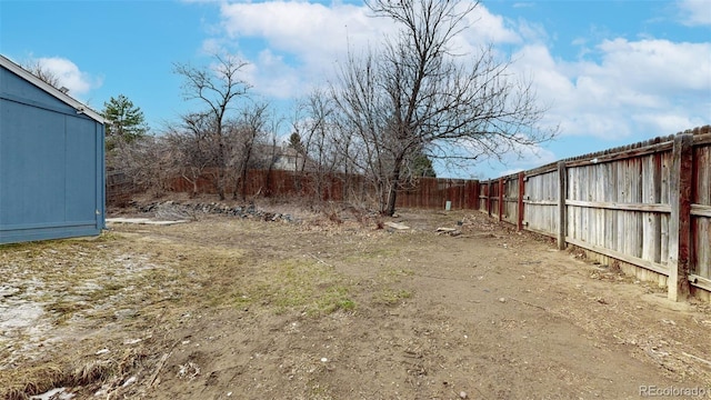 view of yard with a fenced backyard