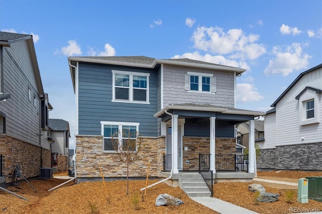 22363 E 6th Pl, Aurora, CO 80018 - view of front of property featuring a porch, central AC, and stone siding
