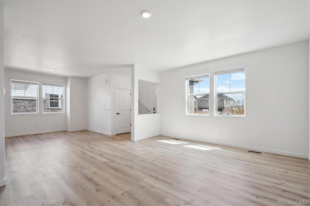 22363 E 6th Pl, Aurora, CO 80018 - spare room with light wood finished floors and baseboards