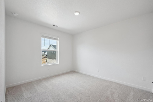 22363 E 6th Pl, Aurora, CO 80018 - spare room with baseboards, carpet floors, and a smoke detector