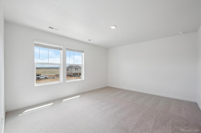22363 E 6th Pl, Aurora, CO 80018 - unfurnished room featuring light colored carpet, baseboards, and a smoke detector