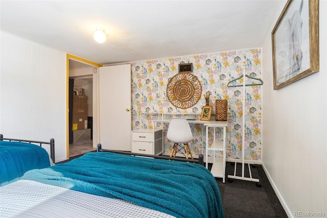 bedroom with baseboards and carpet floors