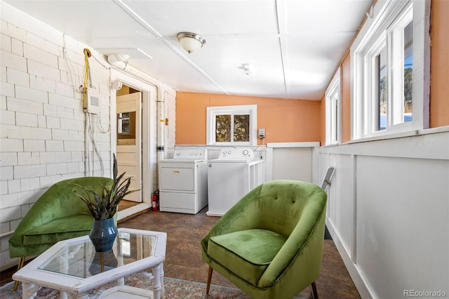living area with washer and dryer and plenty of natural light
